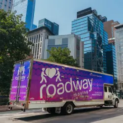 Roadway Moving's truck driving through NYC